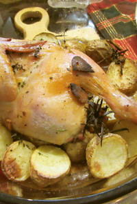 丸鶏を半分に切って焼くローストチキン