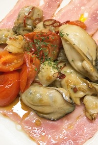 牡蠣とトマトのピリ辛バターニンニク炒め