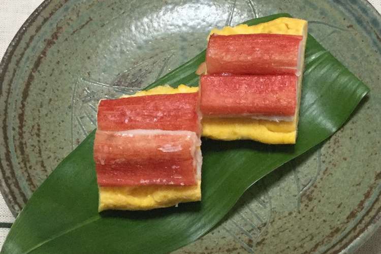 お弁当に カニカマ上のせ 鮮か赤い卵焼き レシピ 作り方 By おはなすき クックパッド 簡単おいしいみんなのレシピが360万品