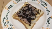 スズキのふじっこ煮カルパッチョトーストの写真