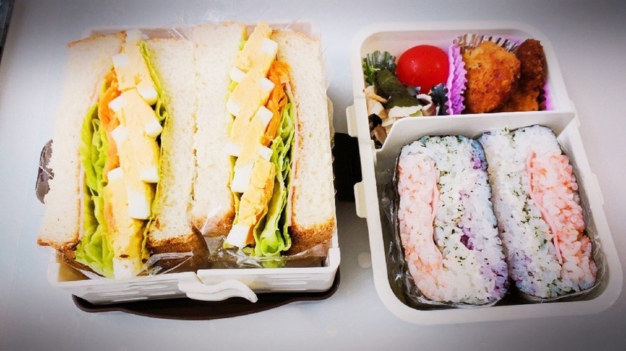 サンドイッチとおにぎらずのお弁当の画像
